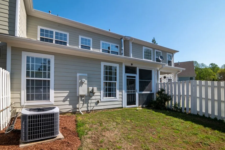 New air conditioner installed beside a home
