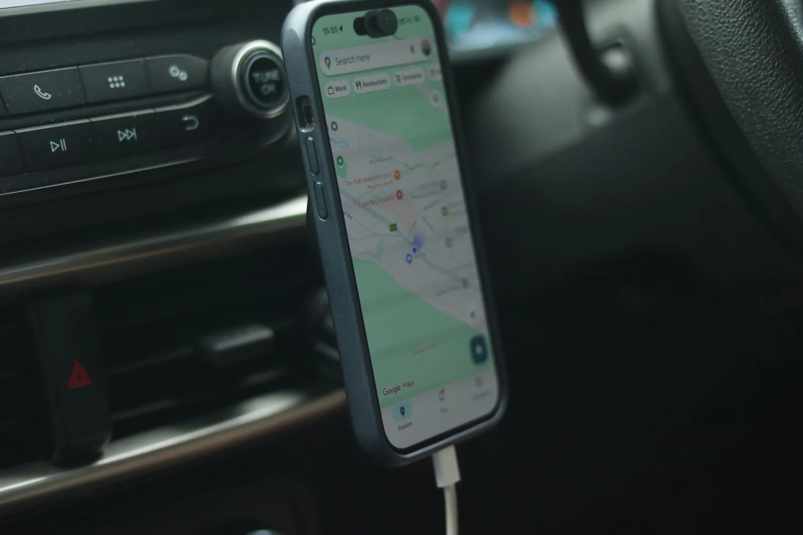 Google Maps open on a phone, where the map pack shows three plumbers